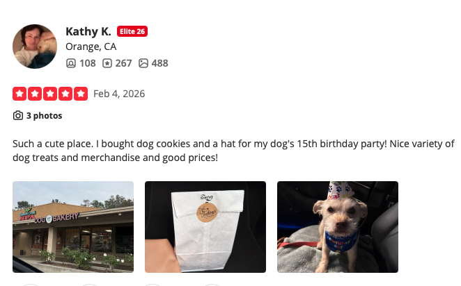 Five-star customer review from Kathy K. praising the dog cookies, birthday hat, variety, and prices